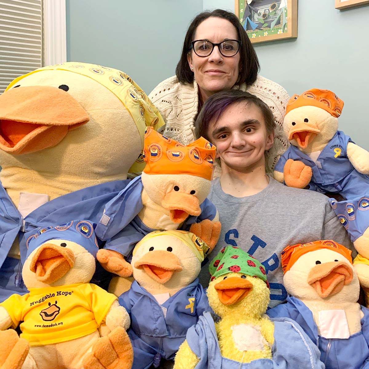 Lu and Gabe pose with Chemo Ducks of all sizes